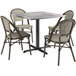 A Lancaster Table & Seating Excalibur square table with a metal base and four chairs.