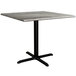 A Lancaster Table & Seating Excalibur square table with a black base.