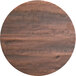 A round wooden table top with a dark wood finish.