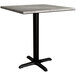 A Lancaster Table & Seating Excalibur square table with a black base.