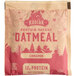 A brown and white Kodiak Cakes Cinnamon Oatmeal packet with red accents.