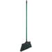A Lavex broom with a green metal handle and black bristles.