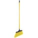A yellow Lavex angled broom with a long black handle.