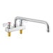 A chrome Regency deck-mounted faucet with two silver handles and a 14" swing spout.