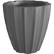 A Mayne graphite gray planter with a curved bottom.