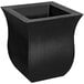 A black square Mayne Valencia planter on a table outdoors.