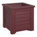 A cranberry red rectangular planter with a square top.