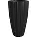 A black curved bottom planter vase.