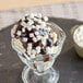 A chocolate ice cream sundae with Mini Vanilla Dehydrated Marshmallow Topping.