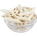 A bowl of Barilla pre-cooked frozen penne pasta on a white background.