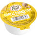 A yellow Sauce Craft container of garlic parmesan dipping sauce.