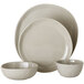 An American Metalcraft Crave 4-piece melamine place setting with plates and bowls stacked on a white background.