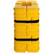 A yellow plastic container with black straps and the words "Column Sentry Fit" in black.