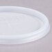 A translucent plastic Cambro lid with a straw slot and a cross on it.