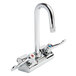 A chrome Equip by T&amp;S wall mount faucet with 2 wrist handles and a gooseneck spout.