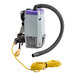 A ProTeam Super Coach backpack vacuum with a hose attached to a wand.