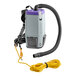 A ProTeam backpack vacuum with a hose and wand attached.