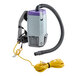 A ProTeam backpack vacuum with a hose and wand attachment.
