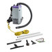 A ProTeam backpack vacuum with hose and accessories including a white carpet tool.