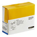 A yellow and white First Aid Only box of fabric bandages.