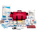 A red First Aid Only first responder kit with supplies and tools in a fabric case.