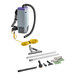 A ProTeam backpack vacuum cleaner with yellow cord and hard surface kit accessories.