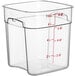 A clear square plastic Cambro food storage container with red writing.