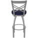 A Holland Bar Stool outdoor counter stool with a blue cushion and back.