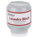 A white container of Noble Chemical laundry blocks with a red label on a counter.
