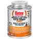 An orange and white can of Oatey CPVC orange lava cement with a black and orange logo.