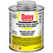 A yellow can of Oatey FlowGuard Gold CPVC cement with white and red text.