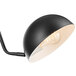 A Globe black and brass plug-in wall sconce with a light bulb.