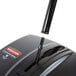 A close up of a Rubbermaid Executive Series floor sweeper with a black handle.