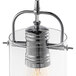 A Globe chrome wall sconce with clear glass shade and pulley accent.
