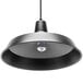 A black Globe Industrial matte black plug-in pendant light fixture with a light bulb.
