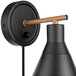 A black wall lamp with a wooden handle and round base.