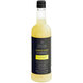 A Twisted Alchemy bottle of lemon sour liquid with a label.