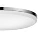 A Globe chrome flush mount light with a white shade.