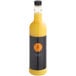 A yellow and black bottle of Twisted Alchemy Cold-Pressed Valencia Orange Juice.