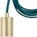 A close-up of a Globe pendant light with a teal cord and brass base.
