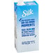 A blue and white carton of Silk Vanilla Almond Milk.