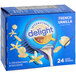 A blue box of International Delight French Vanilla single serve coffee creamer on a counter.