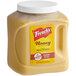 A plastic container of French's Honey Mustard Sauce with a white lid.