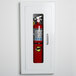 A Strike First EL116 ELITE fire extinguisher cabinet with a full glass door holding a fire extinguisher on a white wall.