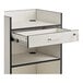 A white Lancaster Table & Seating cash register stand with a locking drawer.
