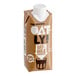 An 11 fl. oz. brown carton of Oatly chocolate oat milk with a white cap.