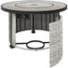 A round stainless steel fire pit on a outdoor patio table.