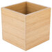 A bamboo cube riser with a square top.