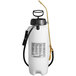 A white Chapin poly sprayer with a black handle and hose.