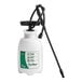 A white plastic Chapin SureSpray sprayer with a black hose and green nozzle.